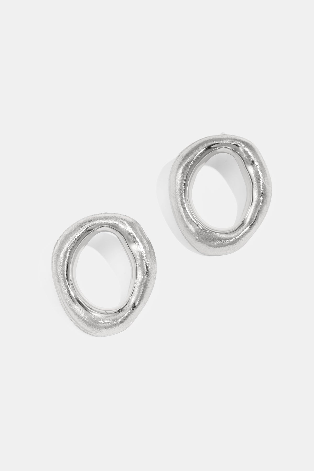 Stud Earrings irregular shape silver color